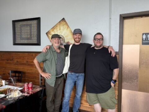 JJ and two guests in a restaurant