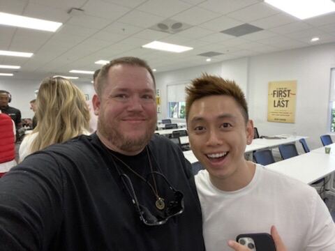 JJ and a guest in a workshop room