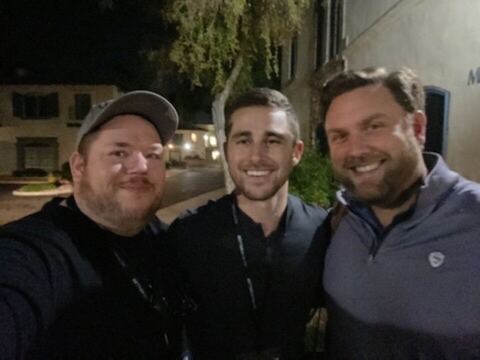 JJ and two guests outdoors at night