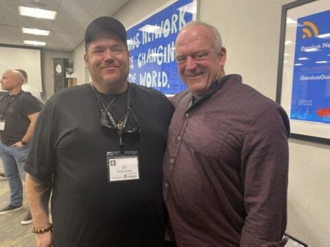 JJ and a guest at a conference