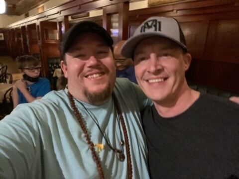JJ and a guest at a dinner